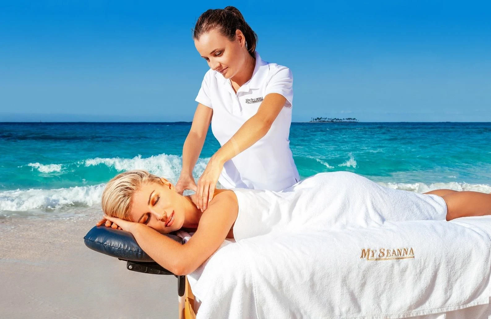 a person and a baby on a beach aboard STARSHIP Yacht for Charter