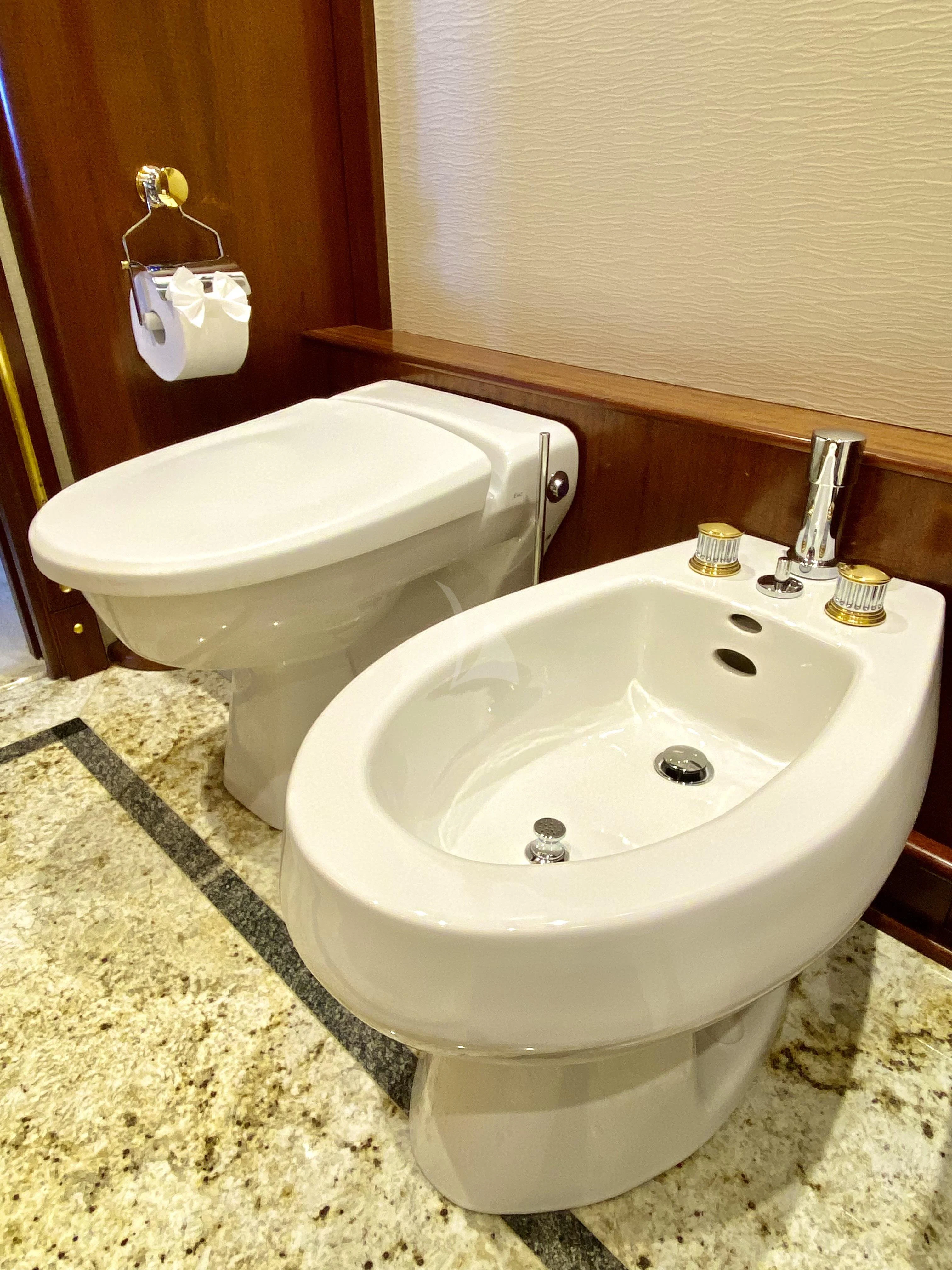 a bathroom with a sink and a toilet aboard STARSHIP Yacht for Charter