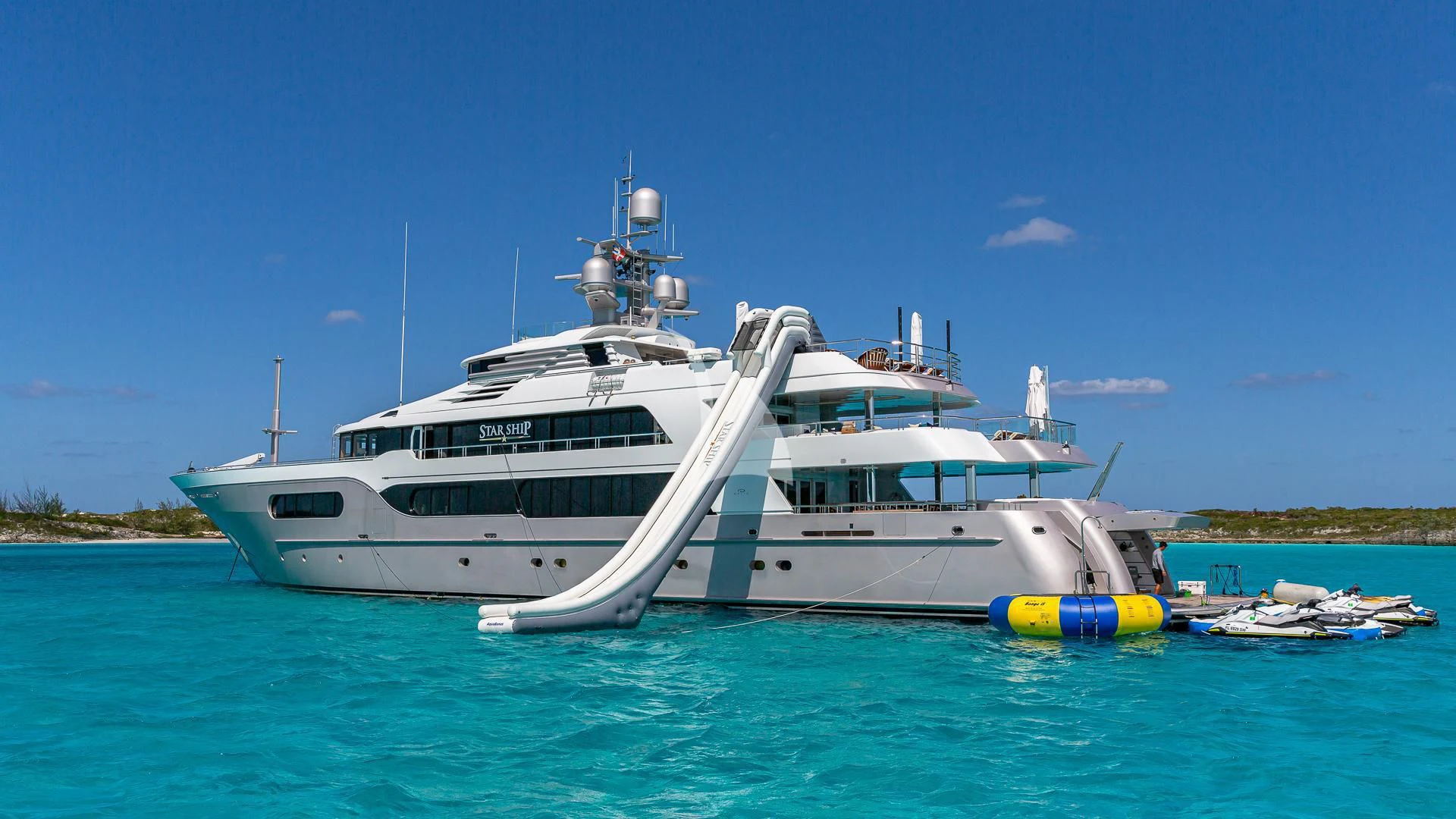 a white boat in the water aboard STARSHIP Yacht for Charter