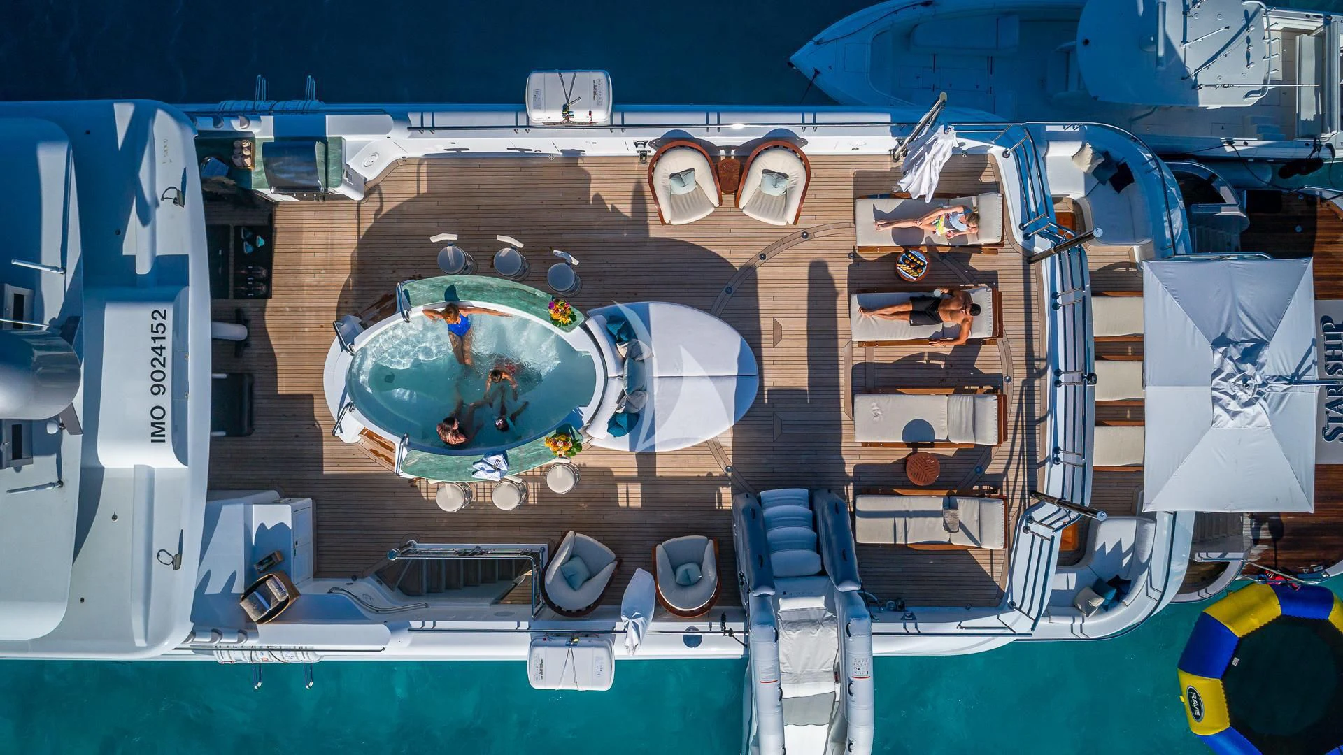 a large toy with a large blue screen aboard STARSHIP Yacht for Charter