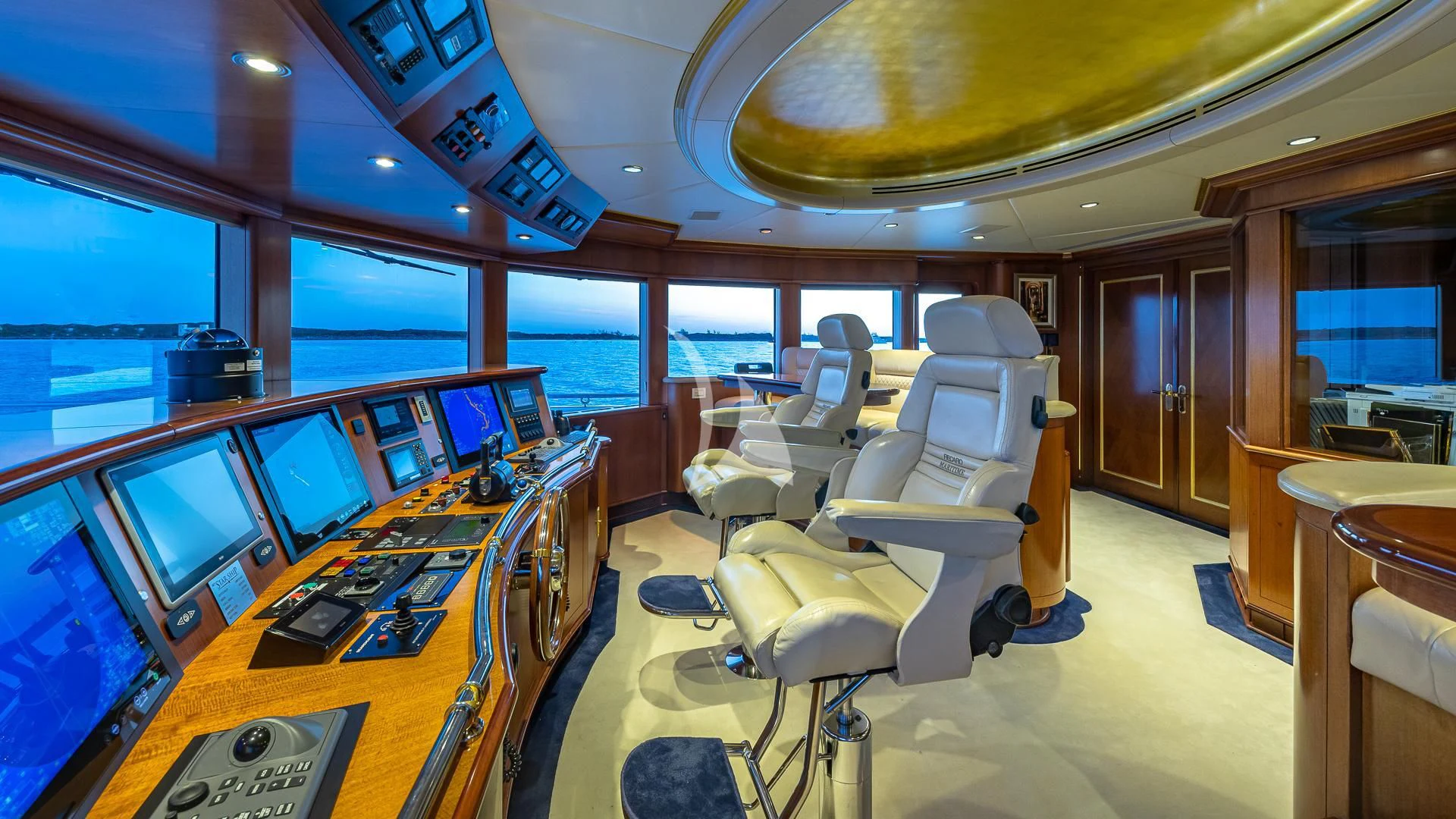 a room with a table and chairs aboard STARSHIP Yacht for Charter