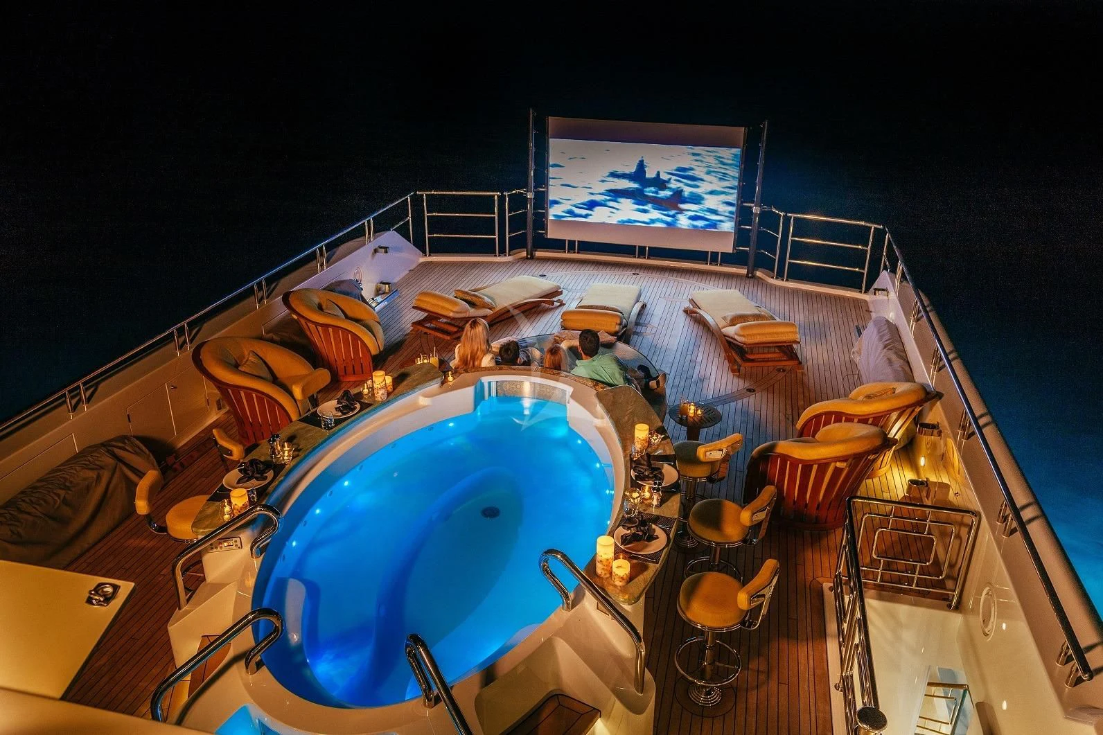 a large round blue swimming pool aboard STARSHIP Yacht for Charter