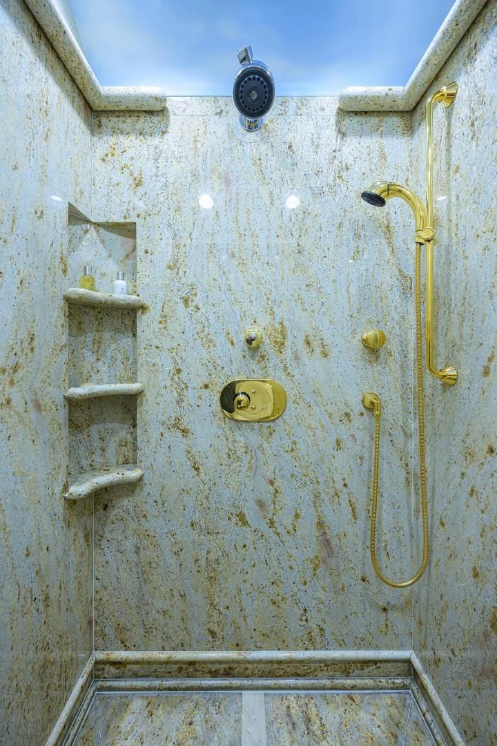 a white wall with a gold chain aboard STARSHIP Yacht for Charter