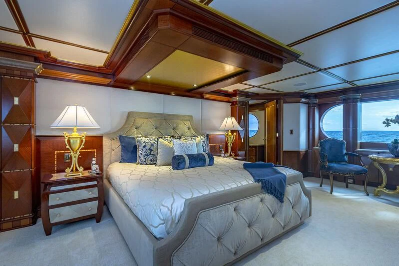 a large bed in a room aboard STARSHIP Yacht for Charter