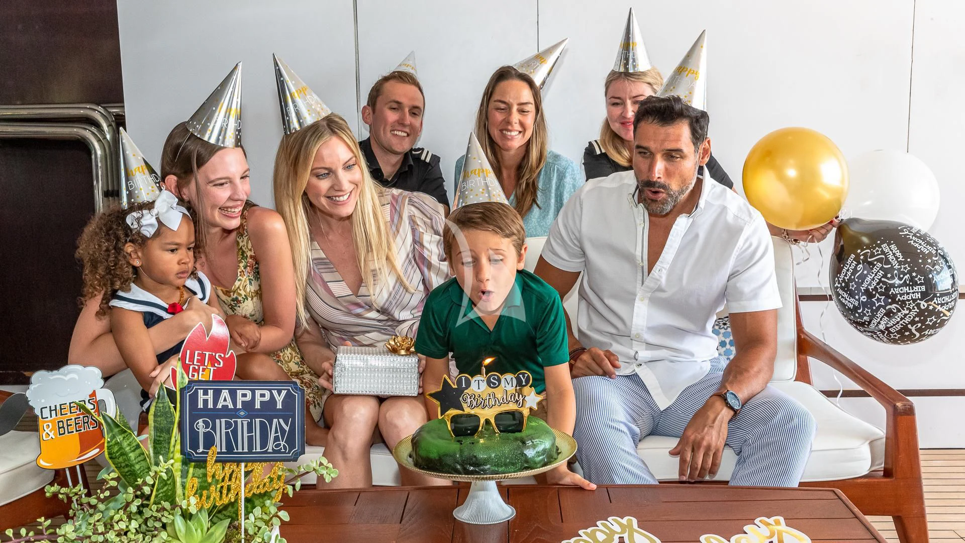 a group of people posing for a photo aboard STARSHIP Yacht for Charter
