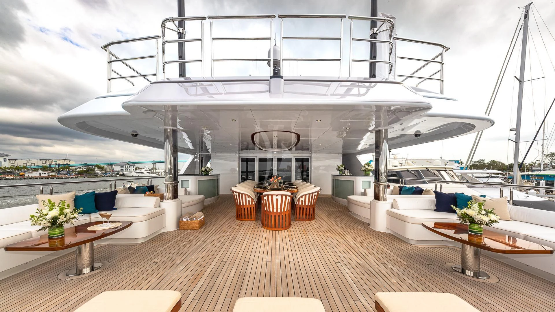 a large white boat on a dock aboard STARSHIP Yacht for Charter