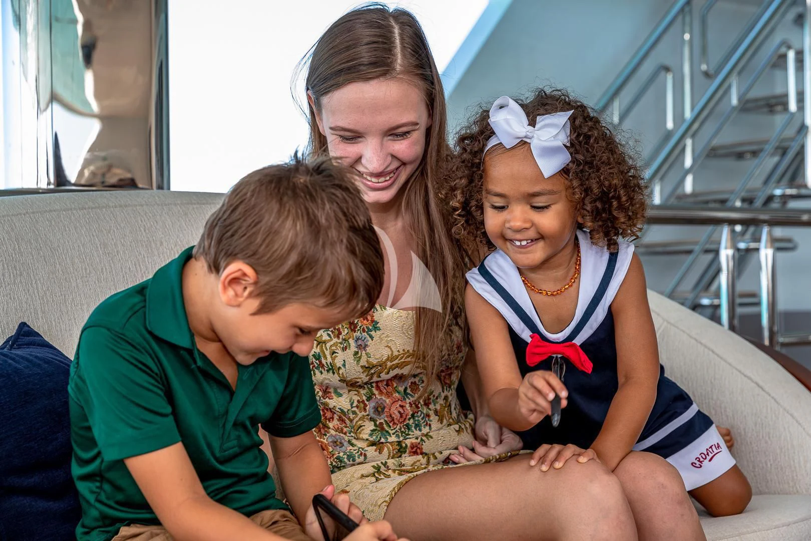 a group of people sitting on a bench aboard STARSHIP Yacht for Charter