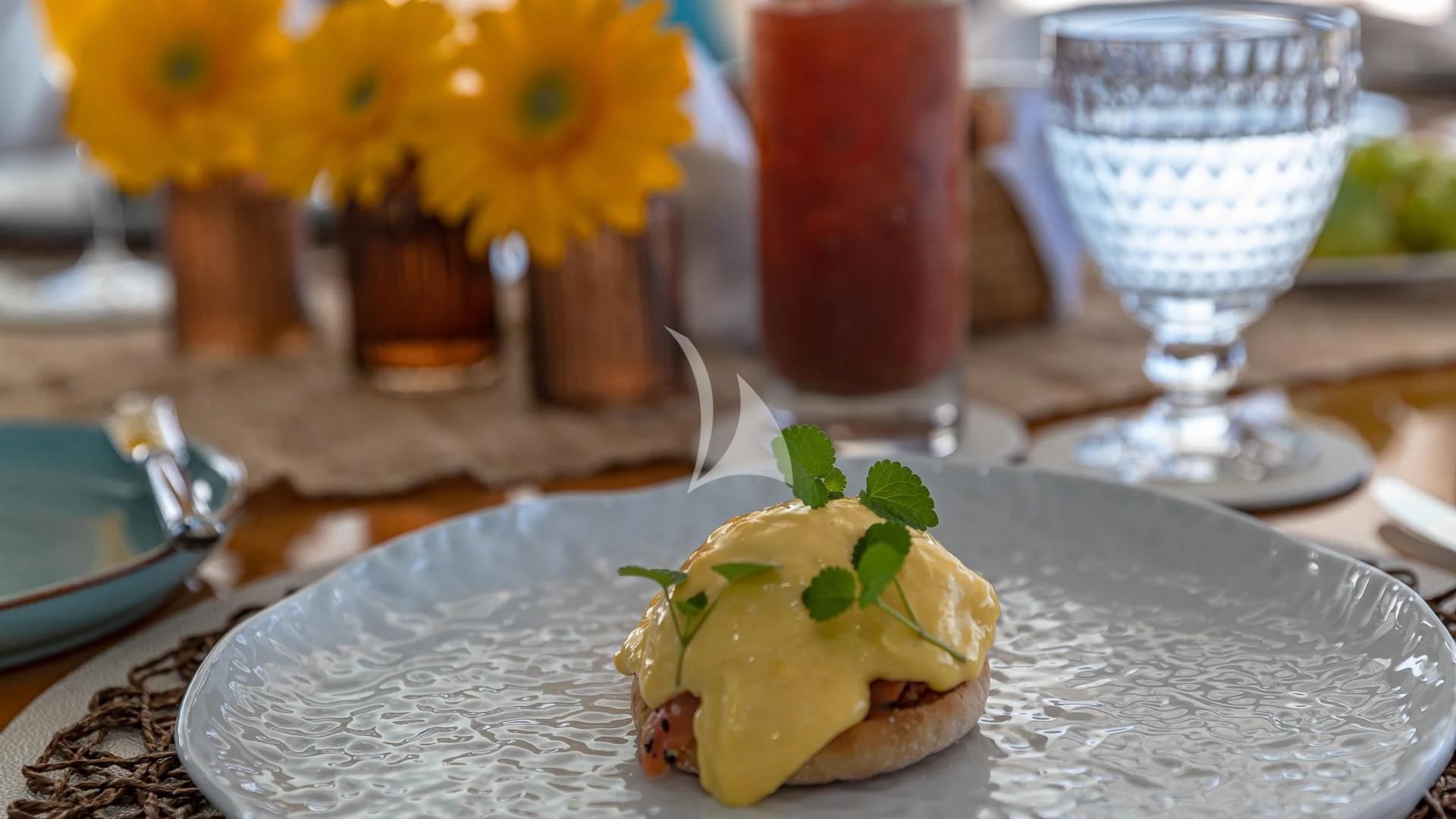 a plate of food and a glass of liquid aboard STARSHIP Yacht for Charter