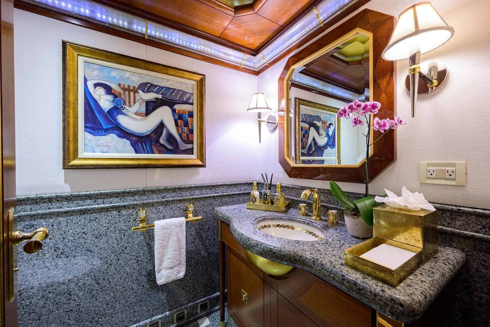 a bathroom with a sink and a mirror aboard STARSHIP Yacht for Charter