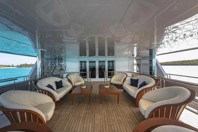 a large living room with a large window aboard STARSHIP Yacht for Charter