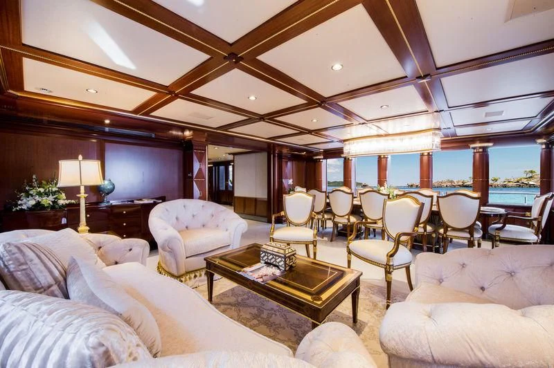 a living room with a large window aboard STARSHIP Yacht for Charter