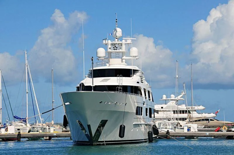 a large white boat in the water aboard STARSHIP Yacht for Charter