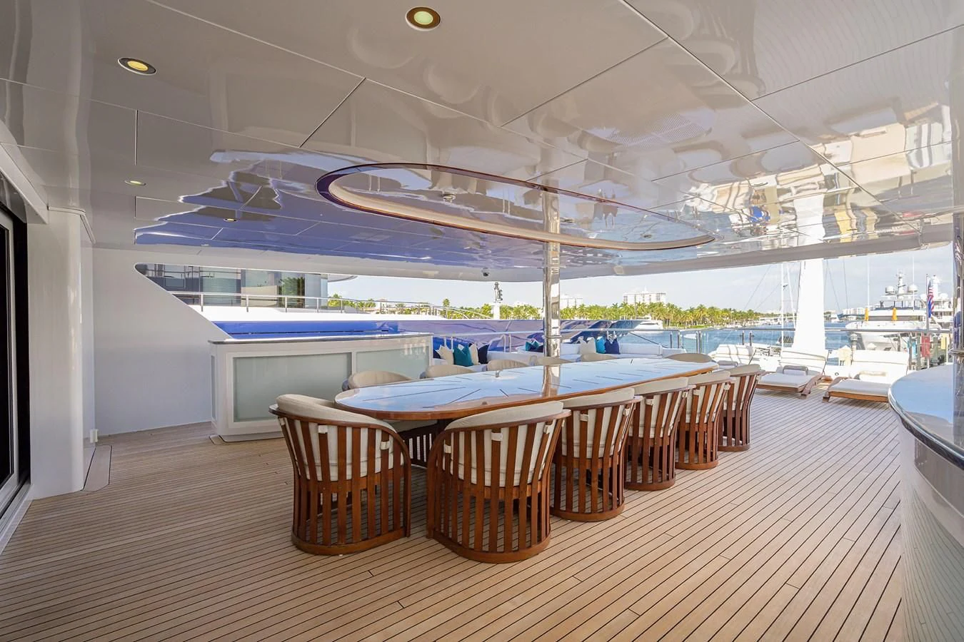 a room with tables and chairs aboard STARSHIP Yacht for Charter