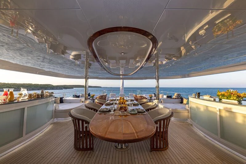 a room with a large chandelier and a large chandelier aboard STARSHIP Yacht for Charter