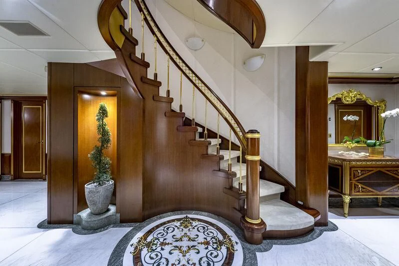 a staircase in a building aboard STARSHIP Yacht for Charter