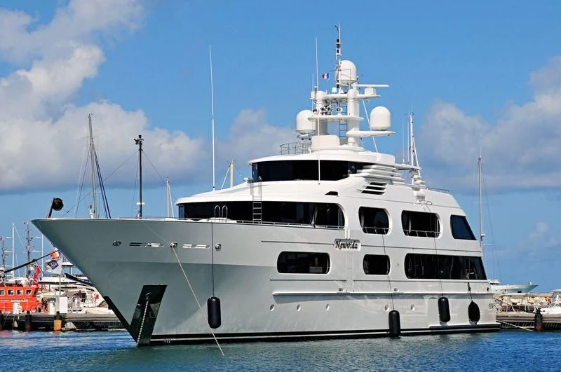 a large white boat in the water aboard STARSHIP Yacht for Charter