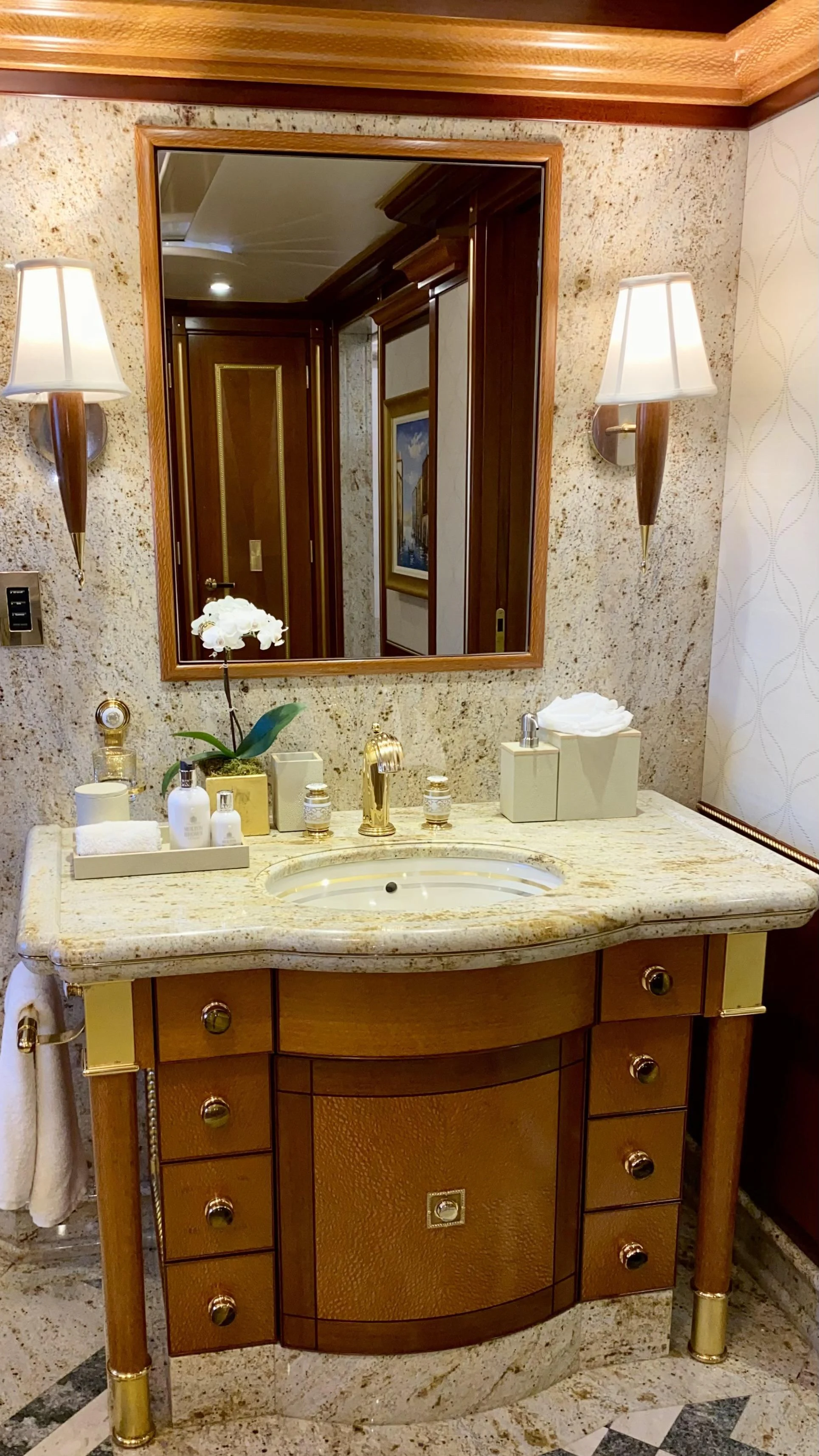 a bathroom with a large mirror aboard STARSHIP Yacht for Charter