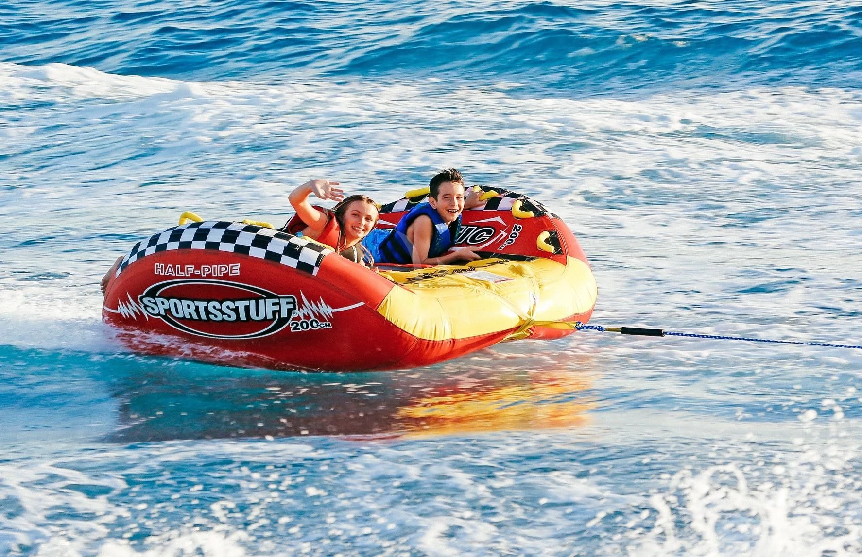 a group of people on a raft in the water aboard STARSHIP Yacht for Charter