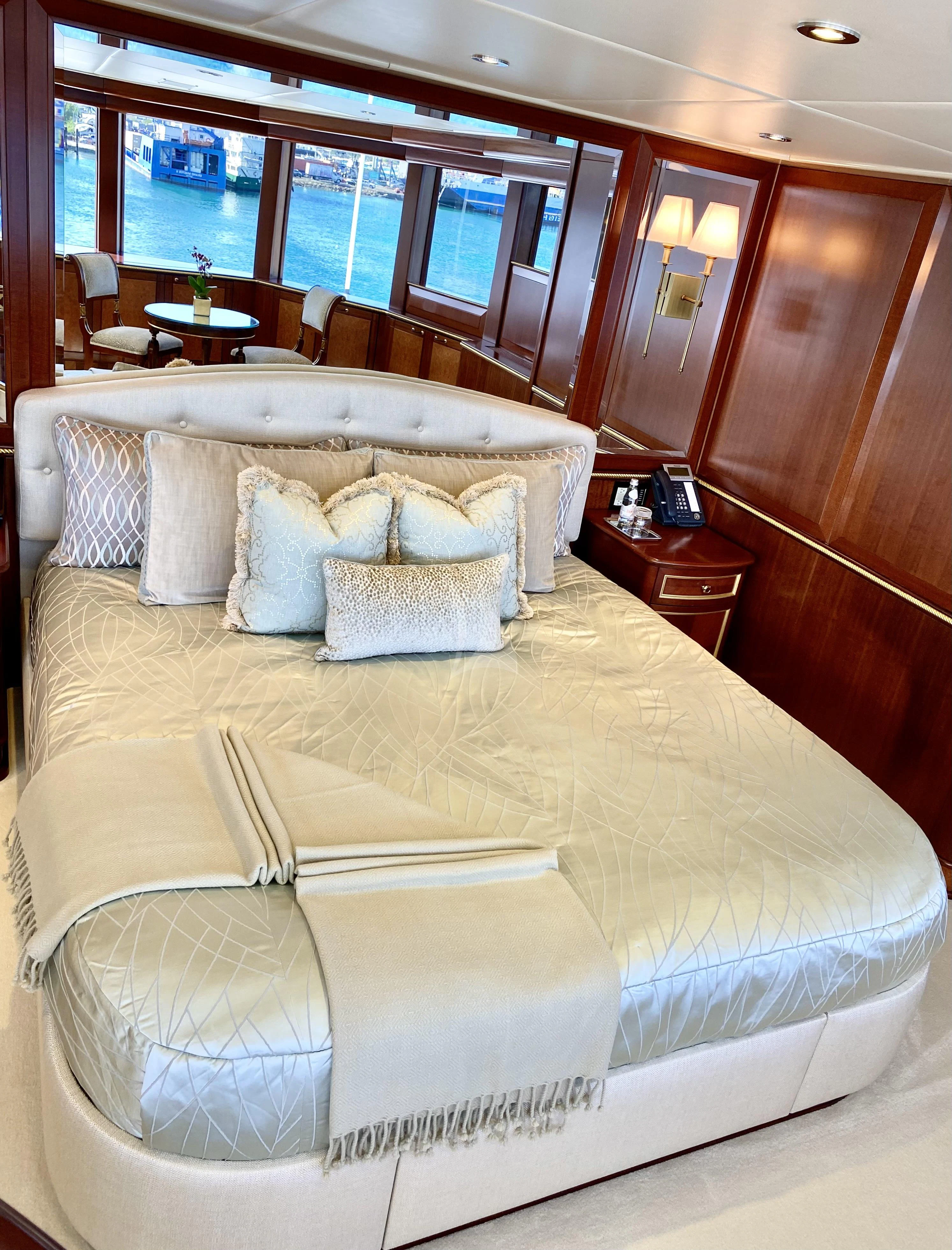 a bed in a room aboard STARSHIP Yacht for Charter