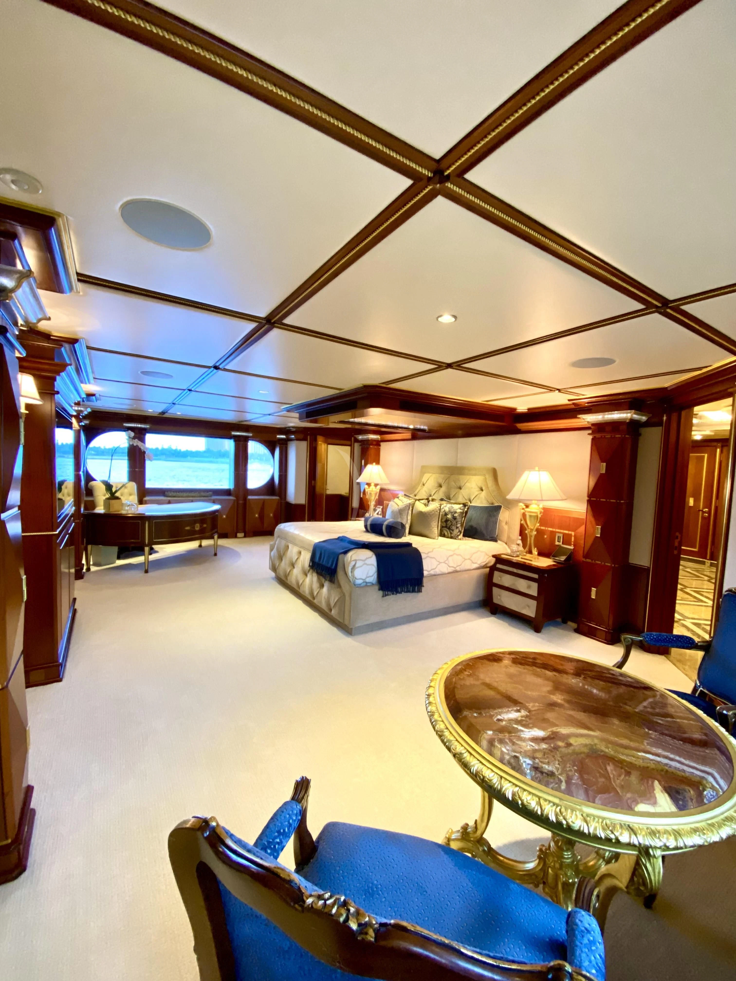 a living room with a large mirror aboard STARSHIP Yacht for Charter