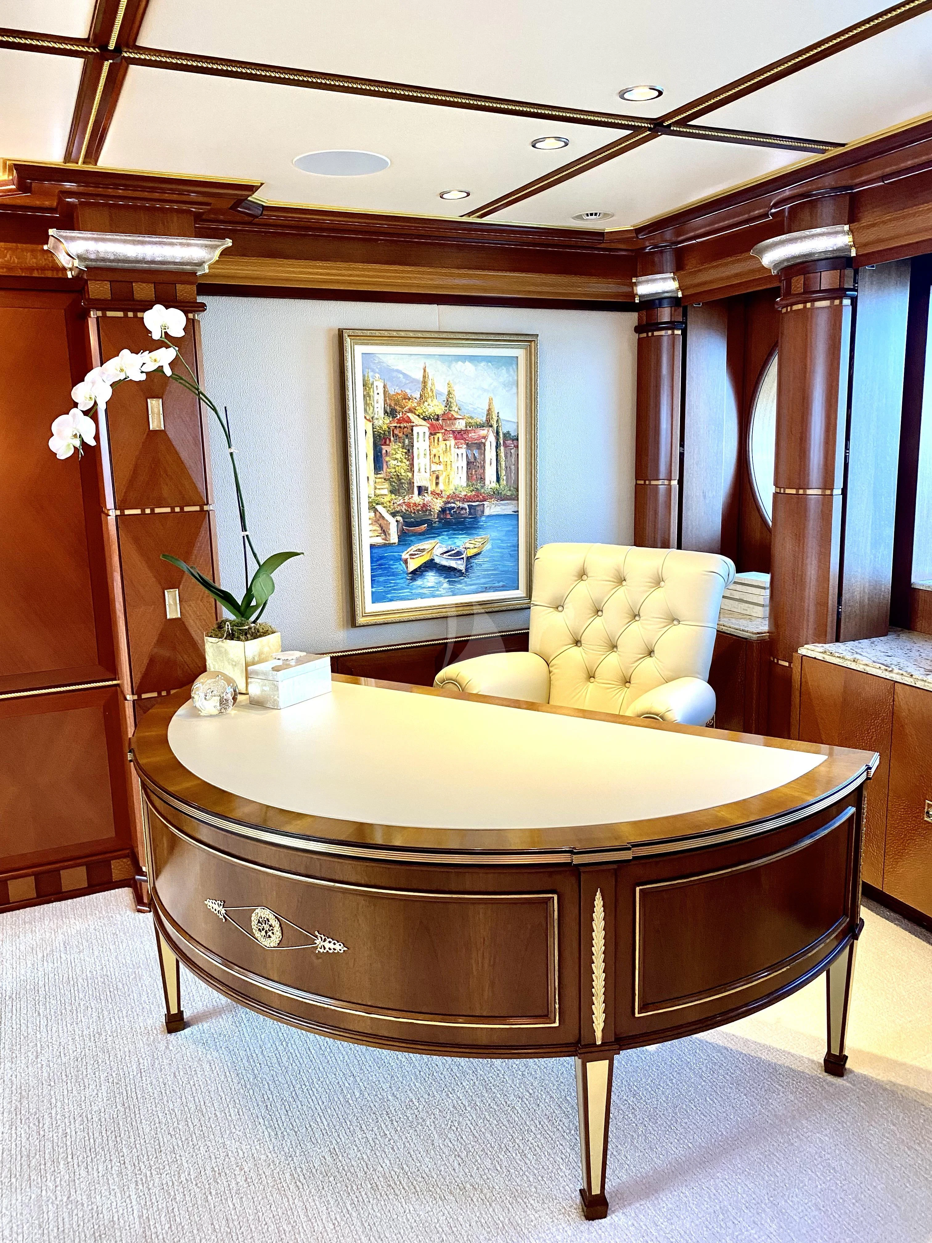 a room with a table and chairs aboard STARSHIP Yacht for Charter