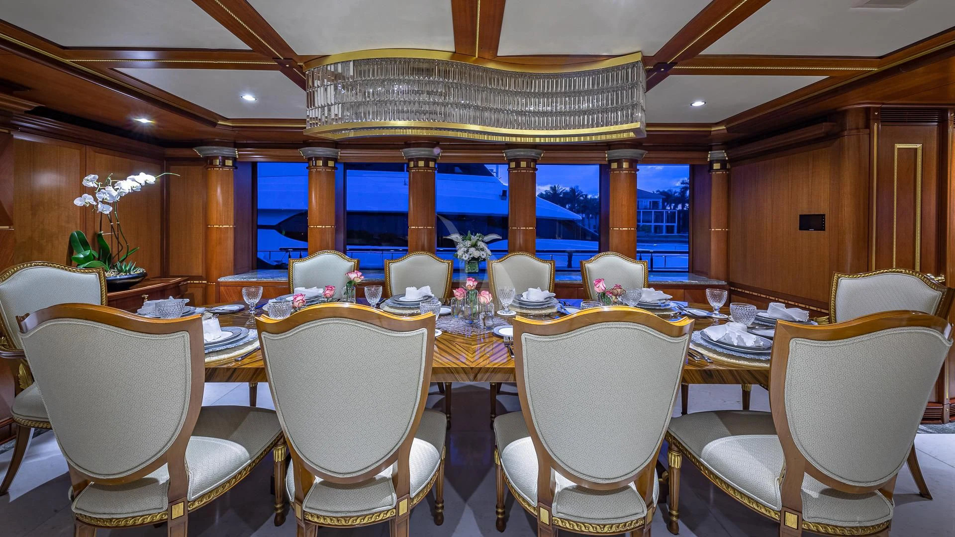 a room with a table and chairs aboard STARSHIP Yacht for Charter