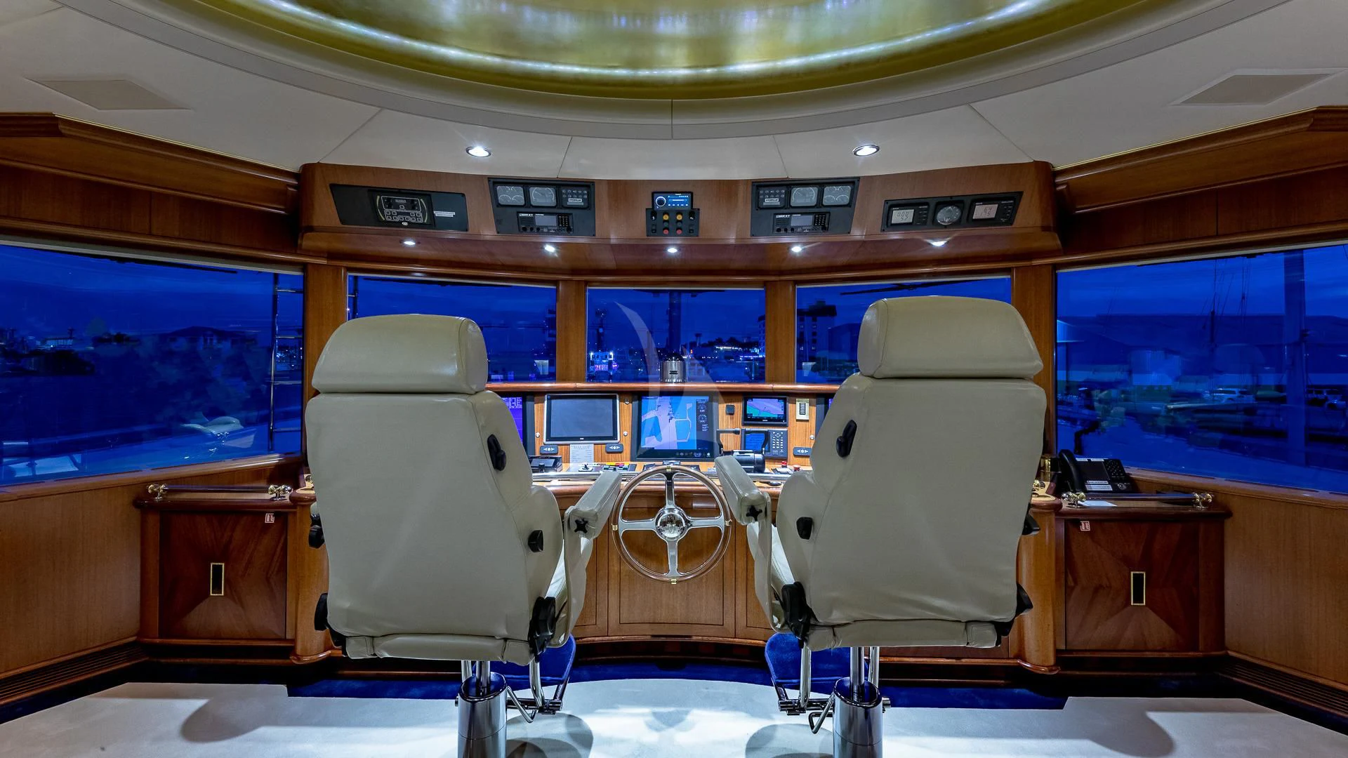 a room with a couple of seats aboard STARSHIP Yacht for Charter