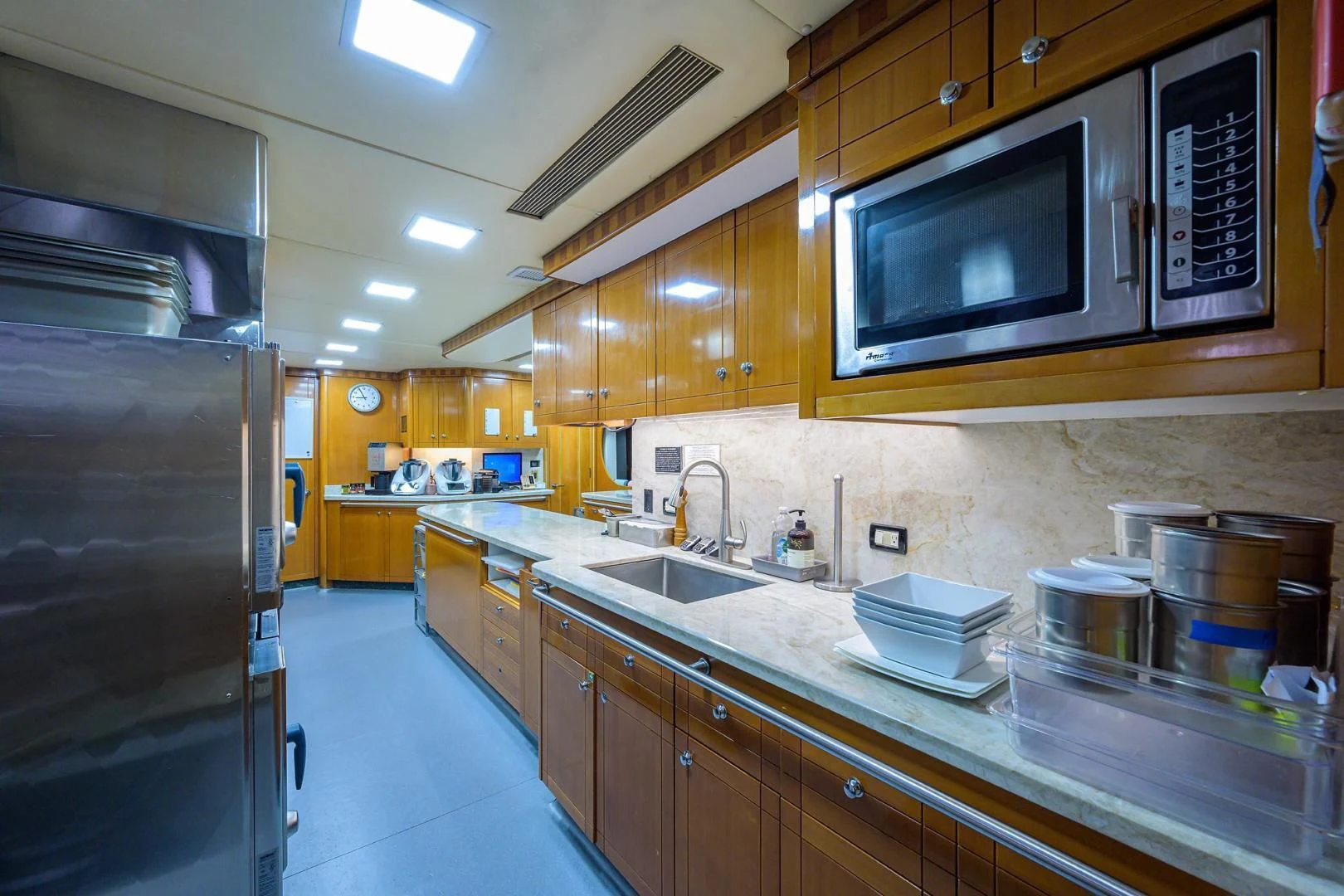 a kitchen with a microwave oven aboard STARSHIP Yacht for Charter