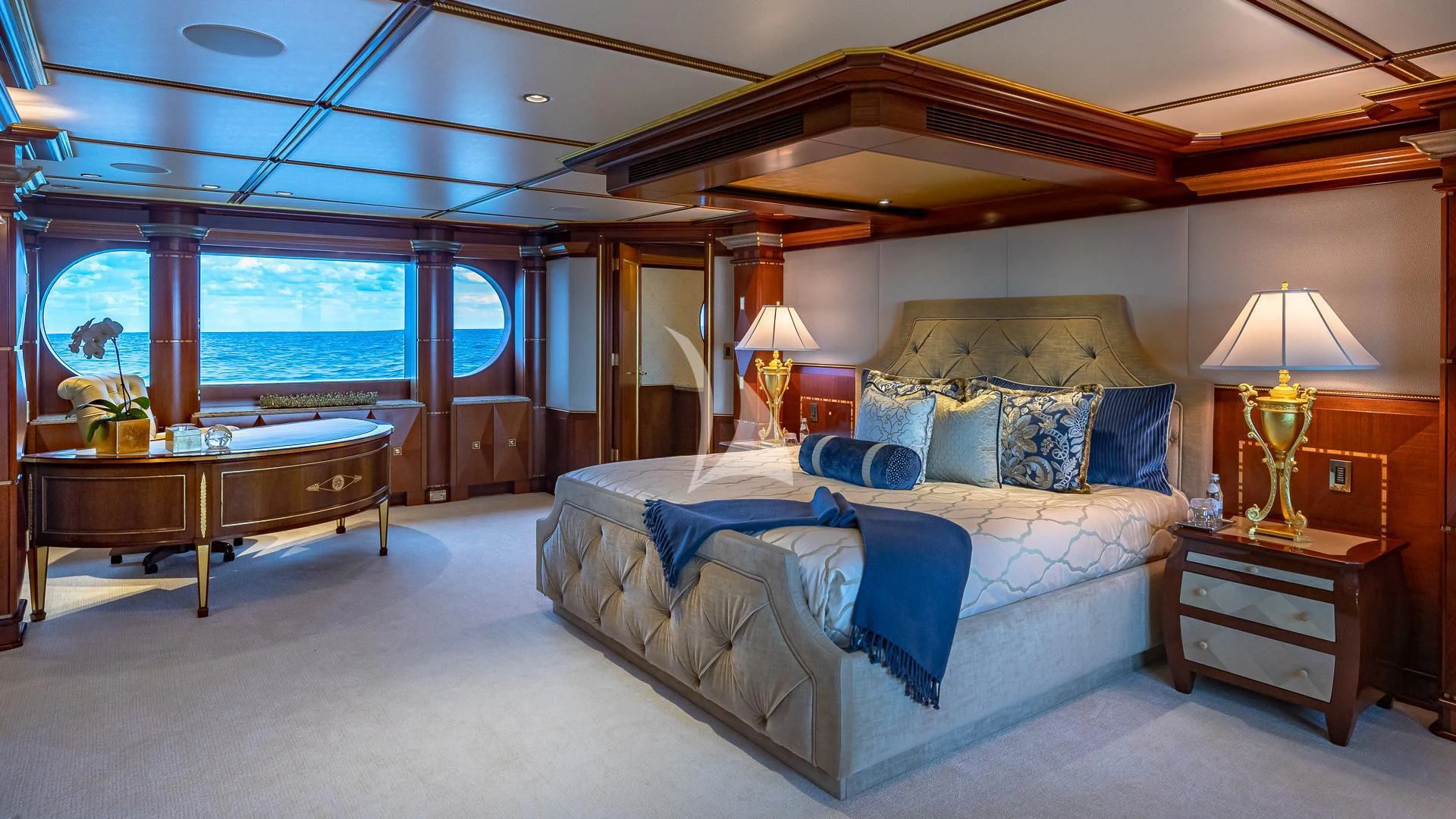 a large bedroom with a large bed aboard STARSHIP Yacht for Charter