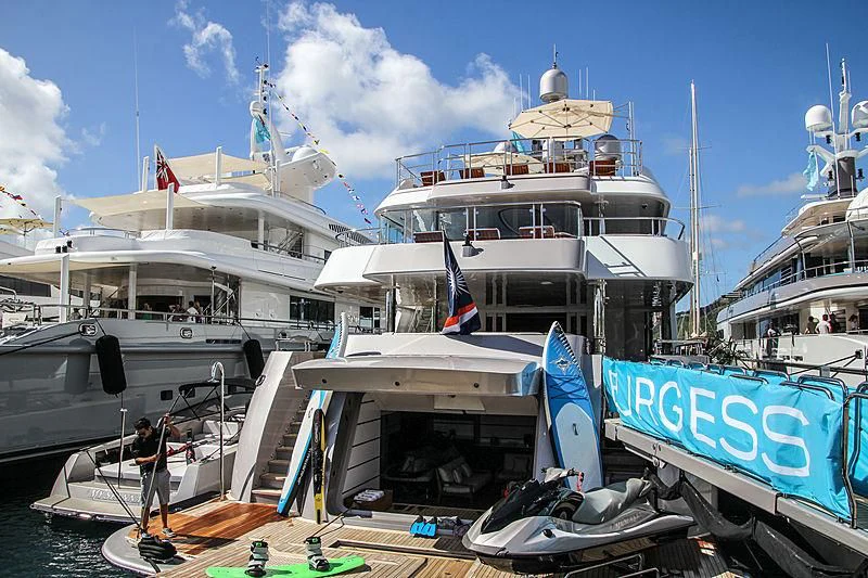 a boat docked at a pier aboard STARSHIP Yacht for Charter