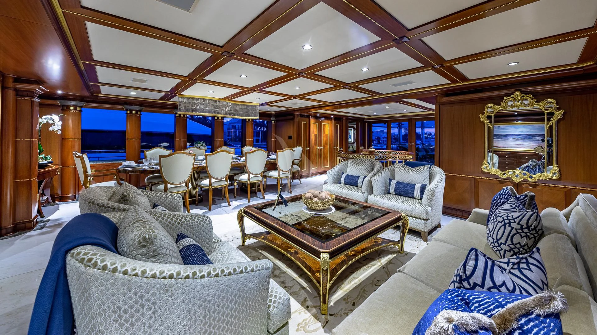 a living room with a large fireplace aboard STARSHIP Yacht for Charter