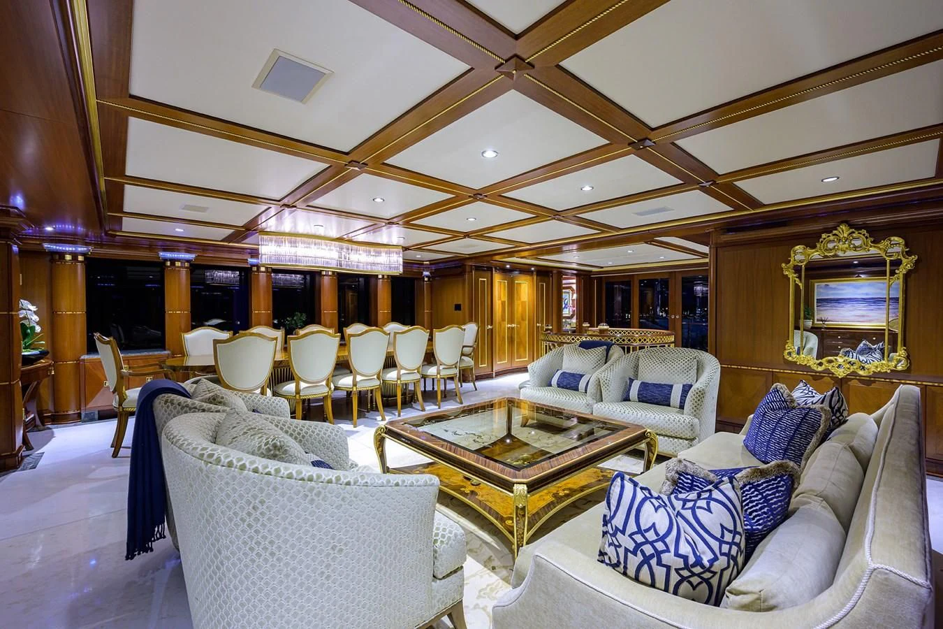 a living room with a table and chairs aboard STARSHIP Yacht for Charter