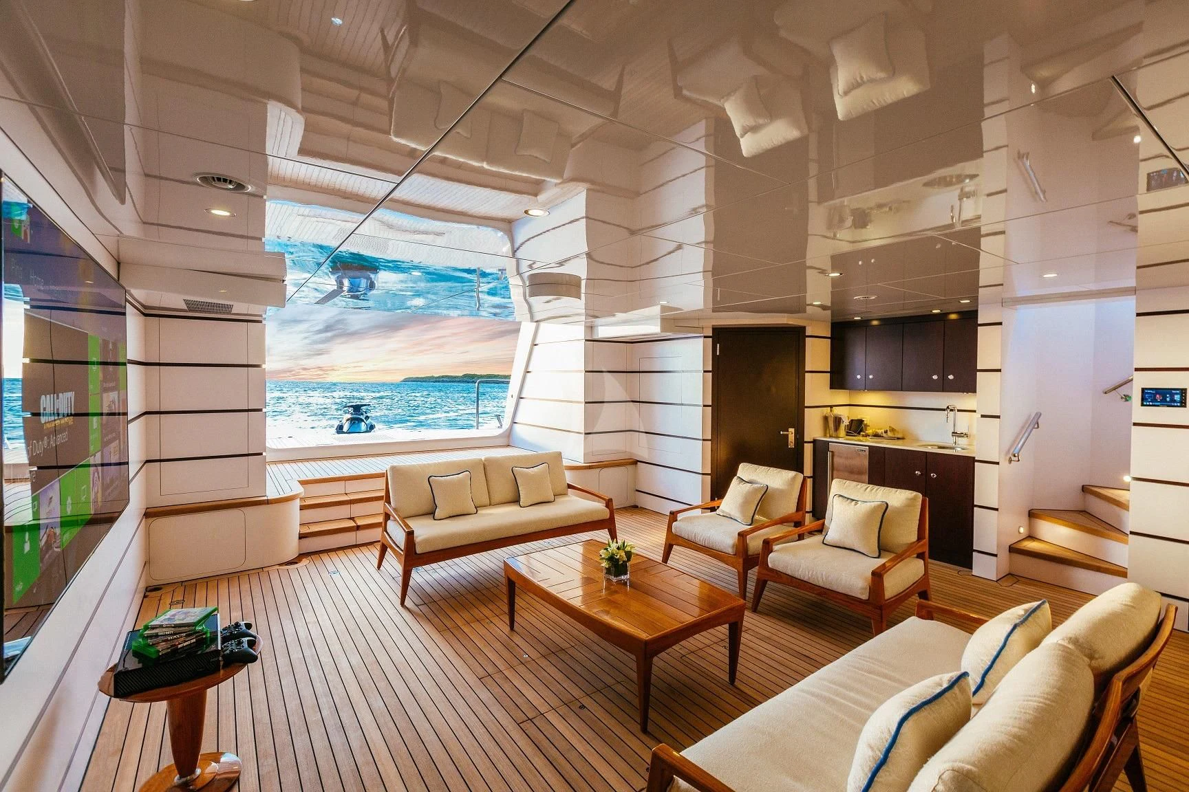 a living room with a large window aboard STARSHIP Yacht for Charter