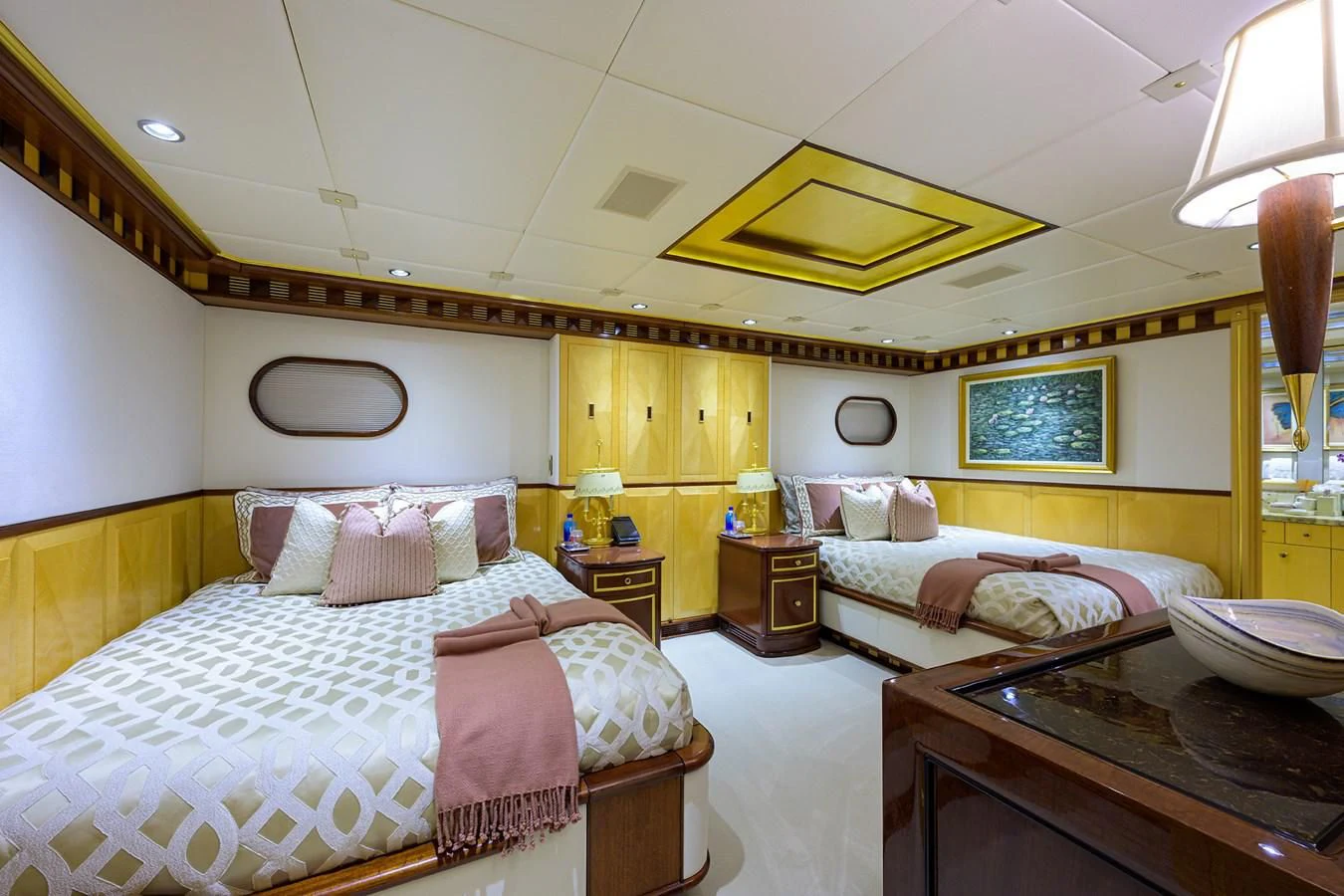 a room with two beds aboard STARSHIP Yacht for Charter