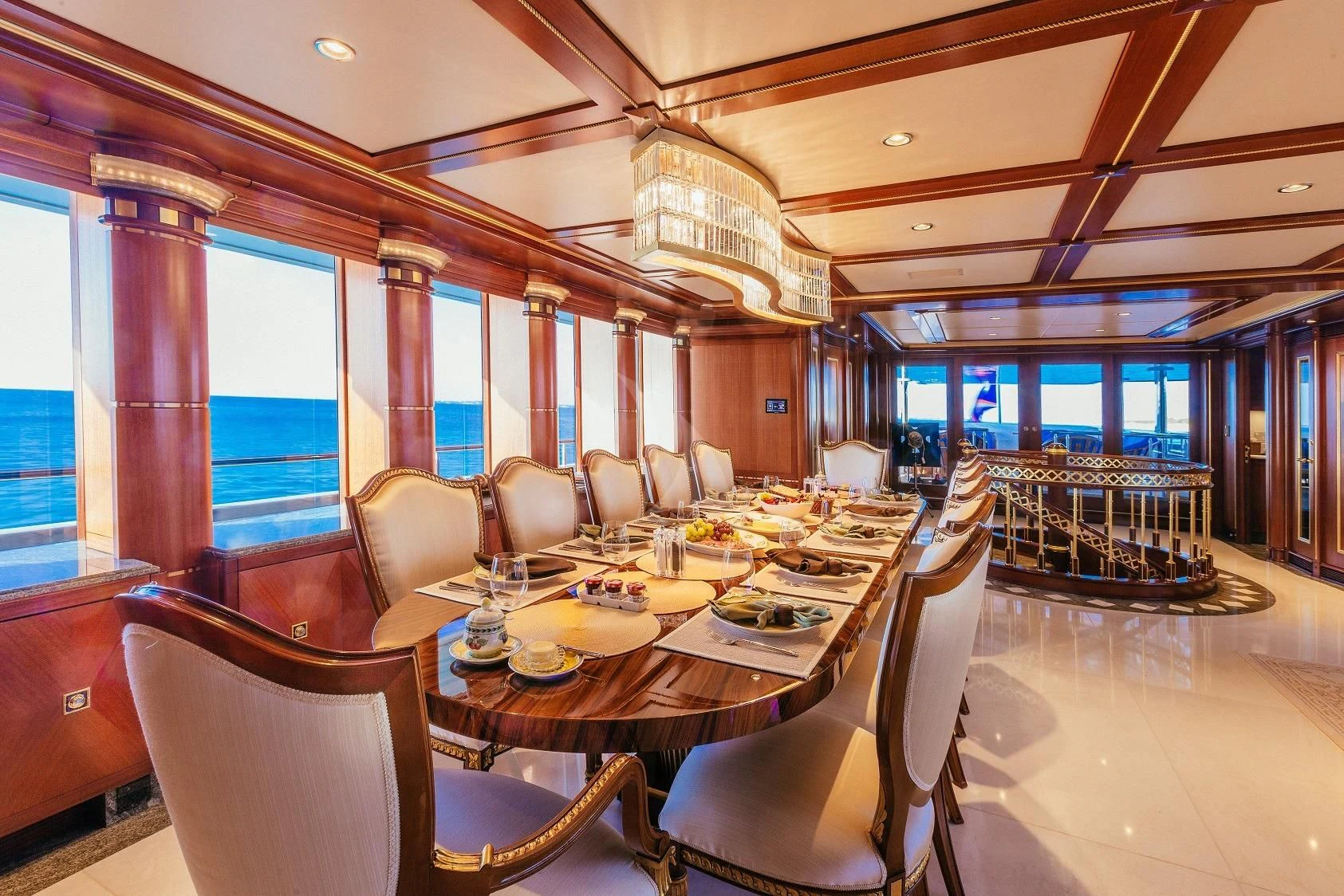 a dining room with a table and chairs aboard STARSHIP Yacht for Charter