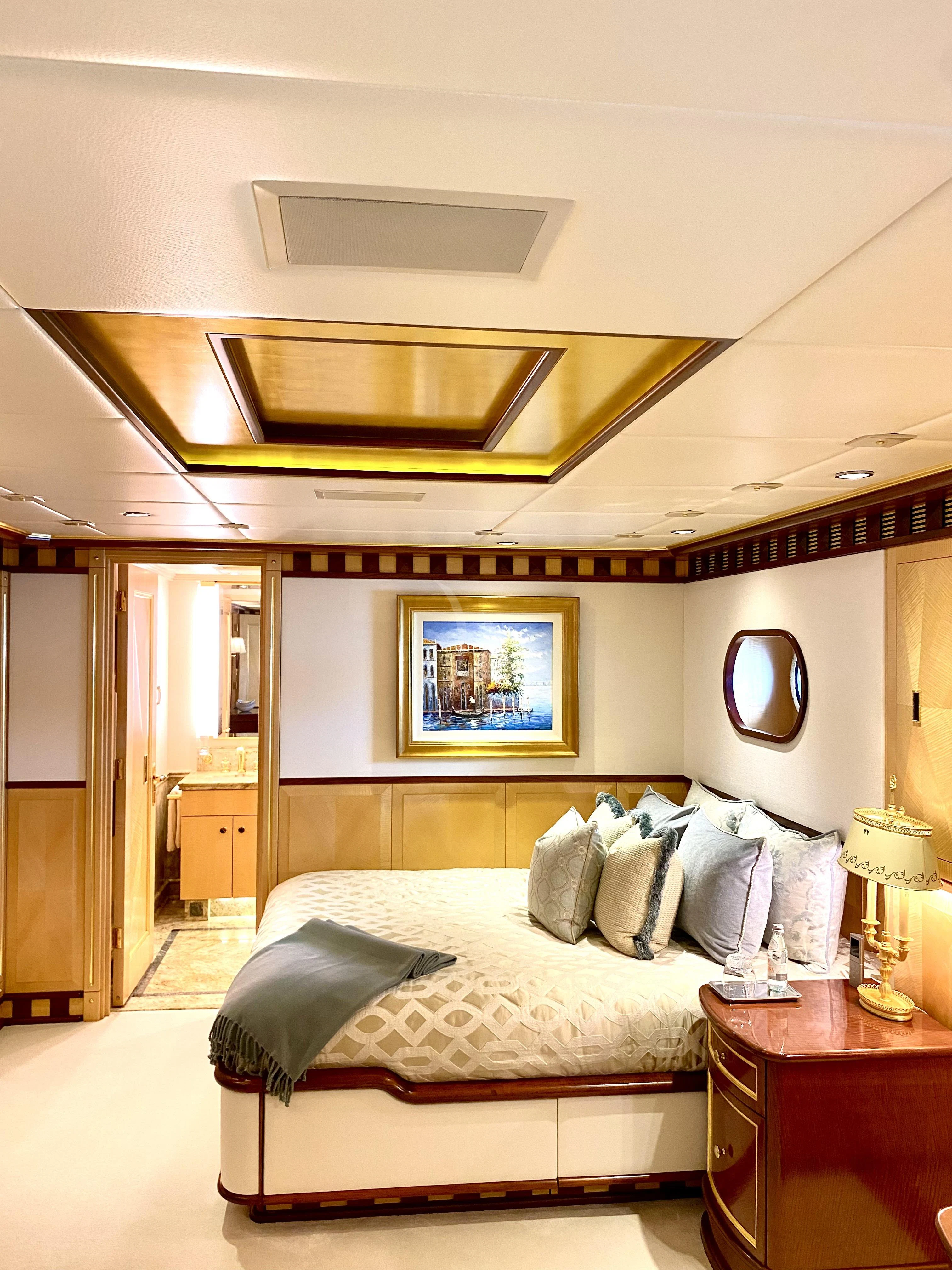 a bed in a hotel room aboard STARSHIP Yacht for Charter