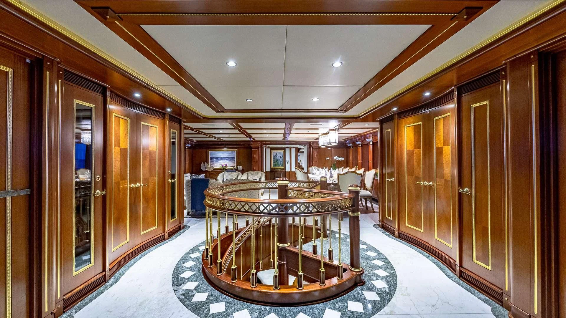 a room with a table and chairs aboard STARSHIP Yacht for Charter