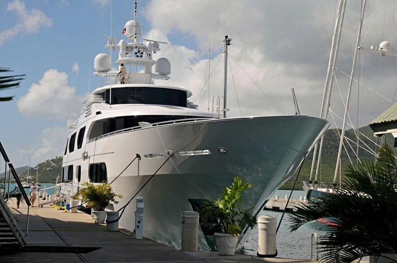 a large white ship docked aboard STARSHIP Yacht for Charter