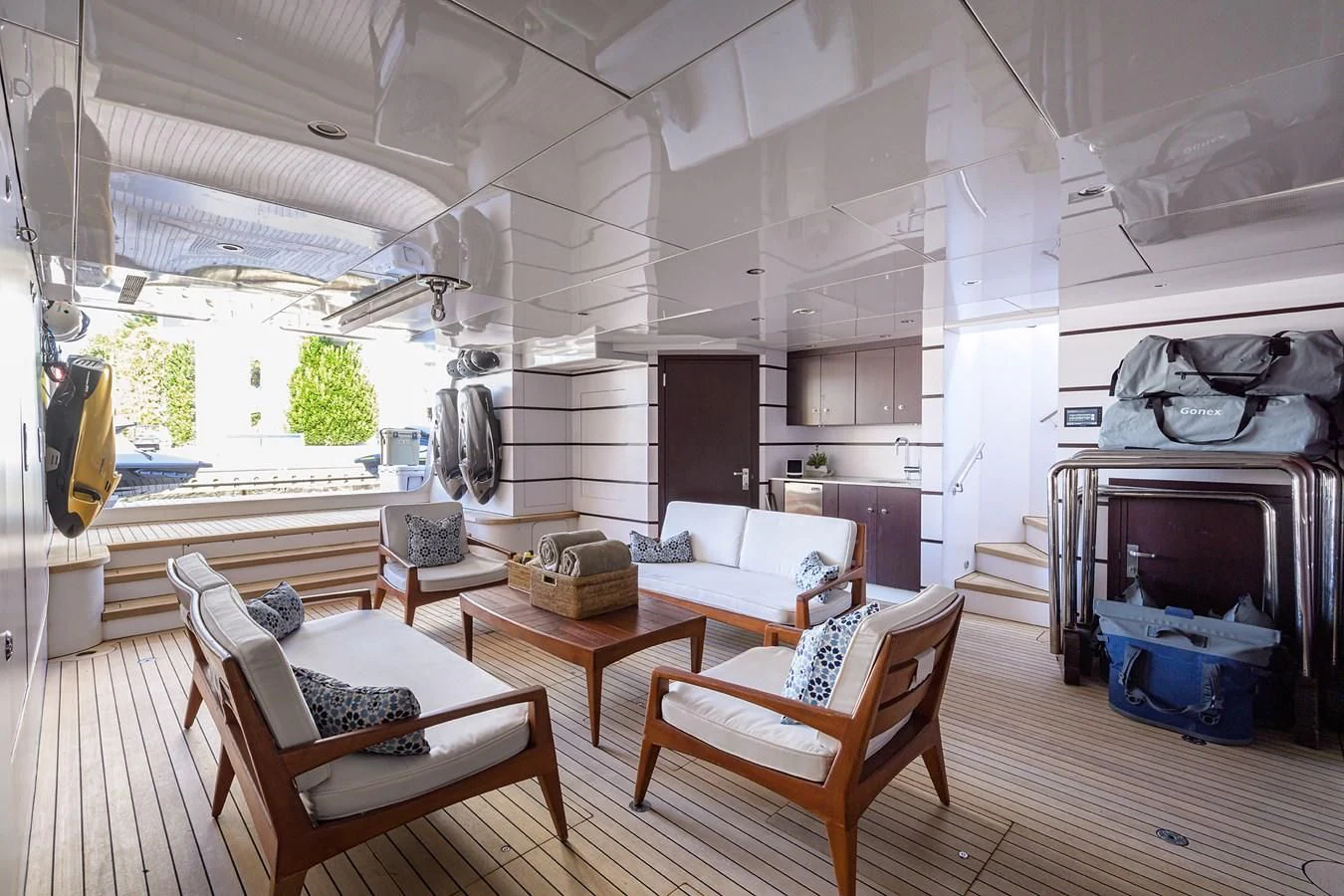 a room with a couch and a table and chairs aboard STARSHIP Yacht for Charter