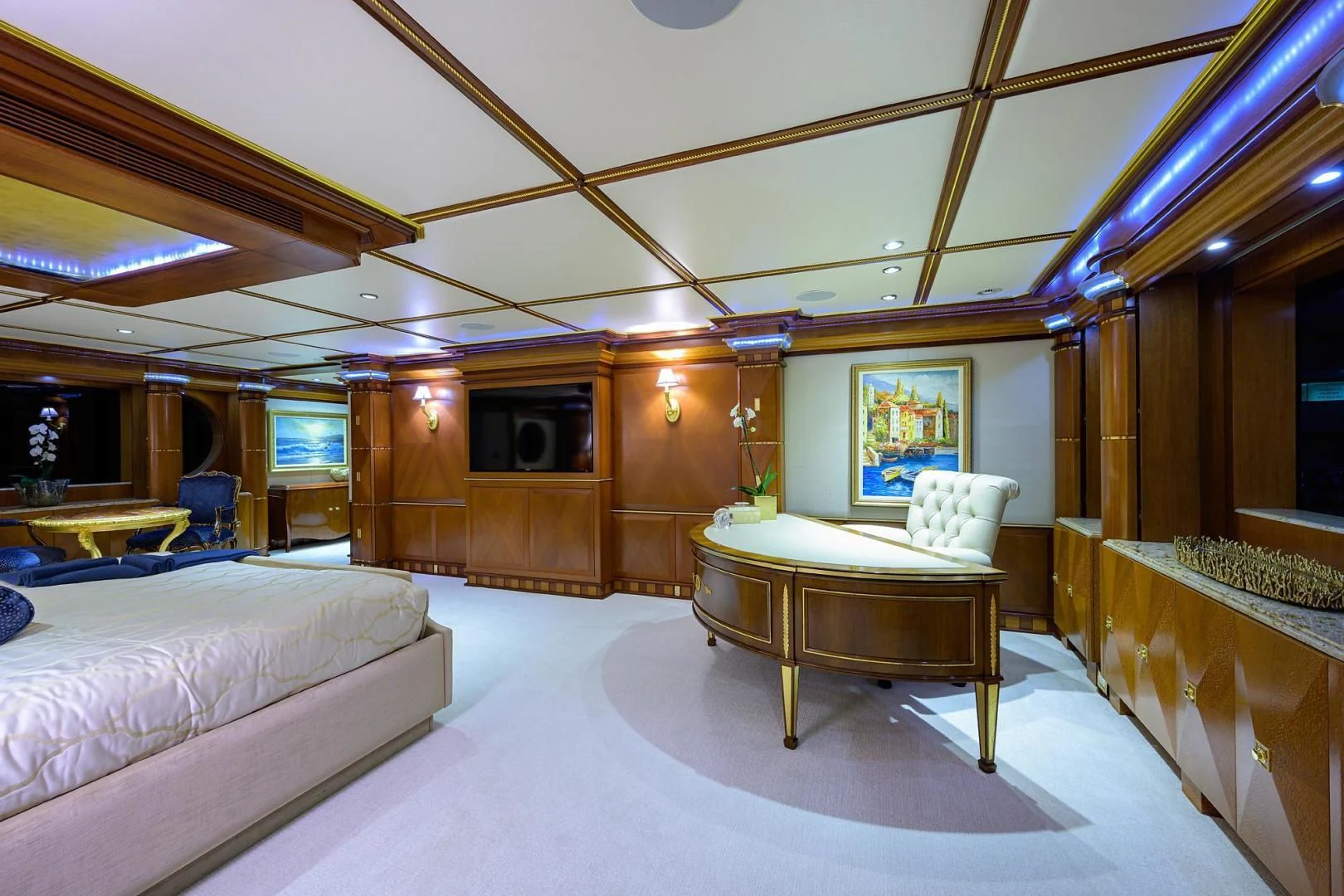 a room with a table and couch aboard STARSHIP Yacht for Charter
