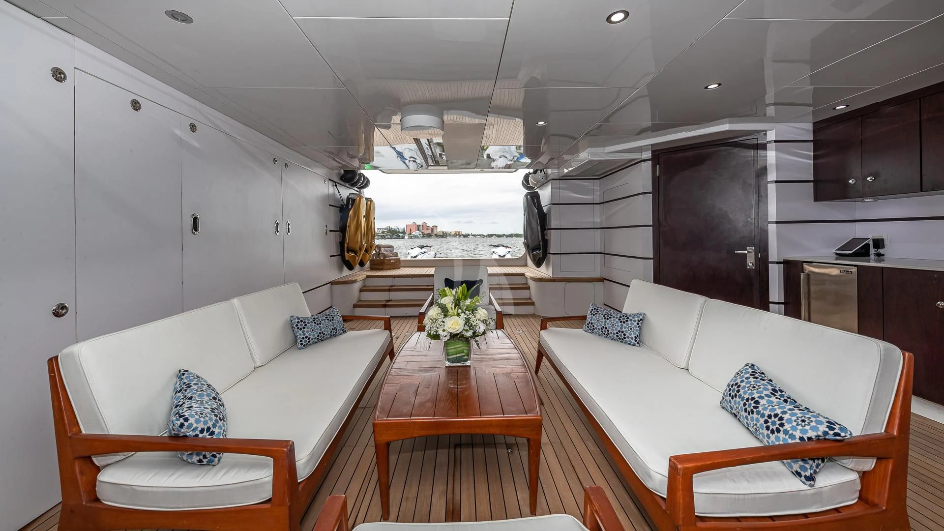 a living room with a couch and a table aboard STARSHIP Yacht for Charter