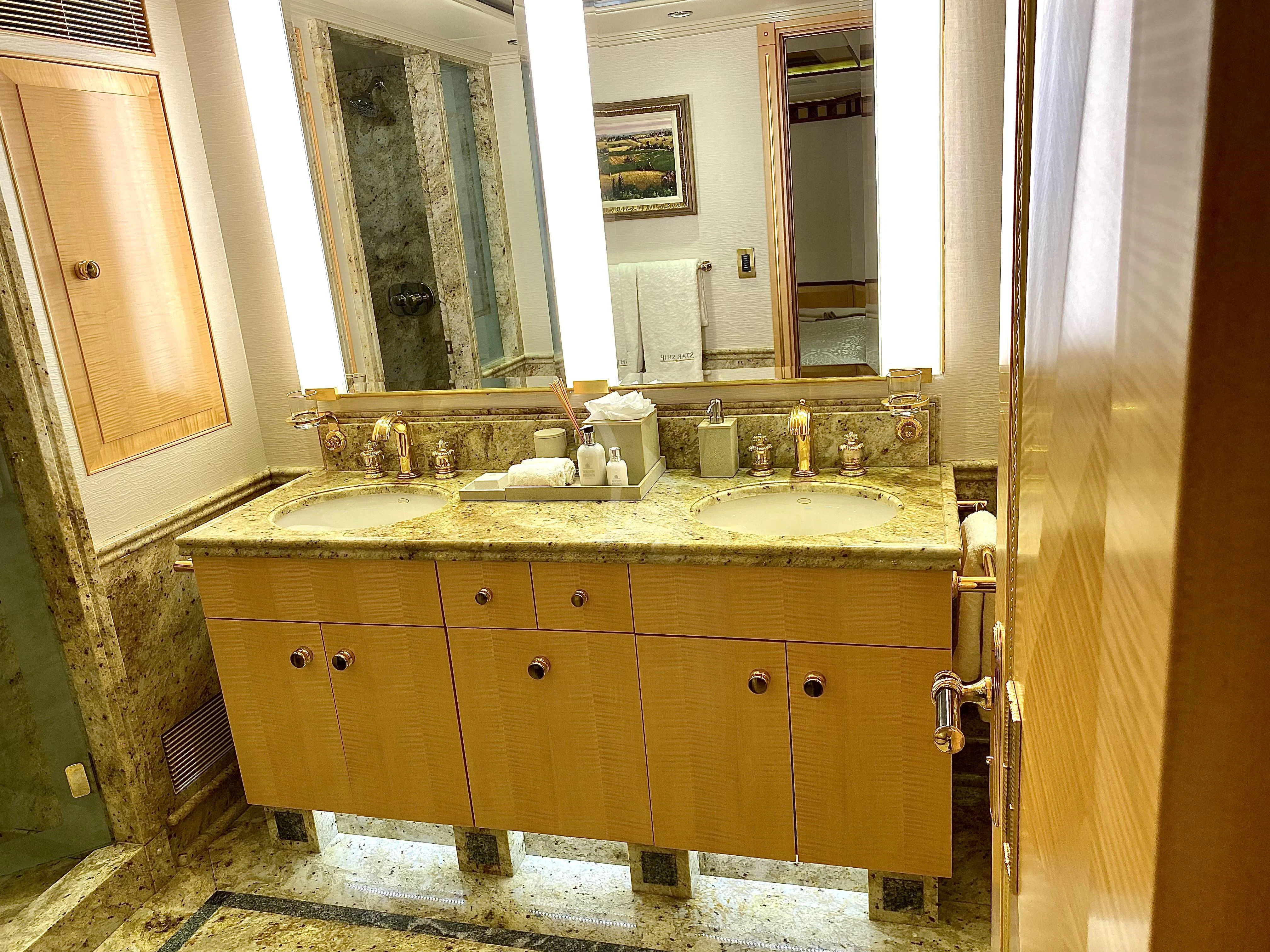 a bathroom with a sink and a mirror aboard STARSHIP Yacht for Charter