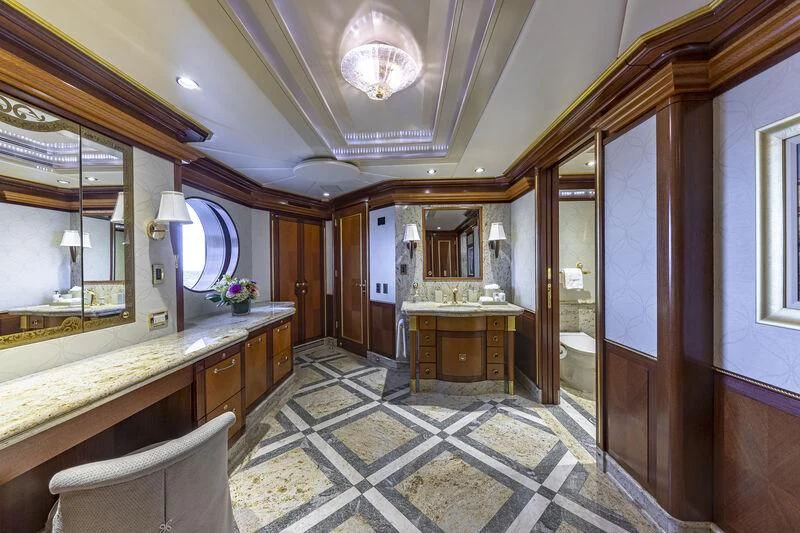 a bathroom with a marble floor aboard STARSHIP Yacht for Charter