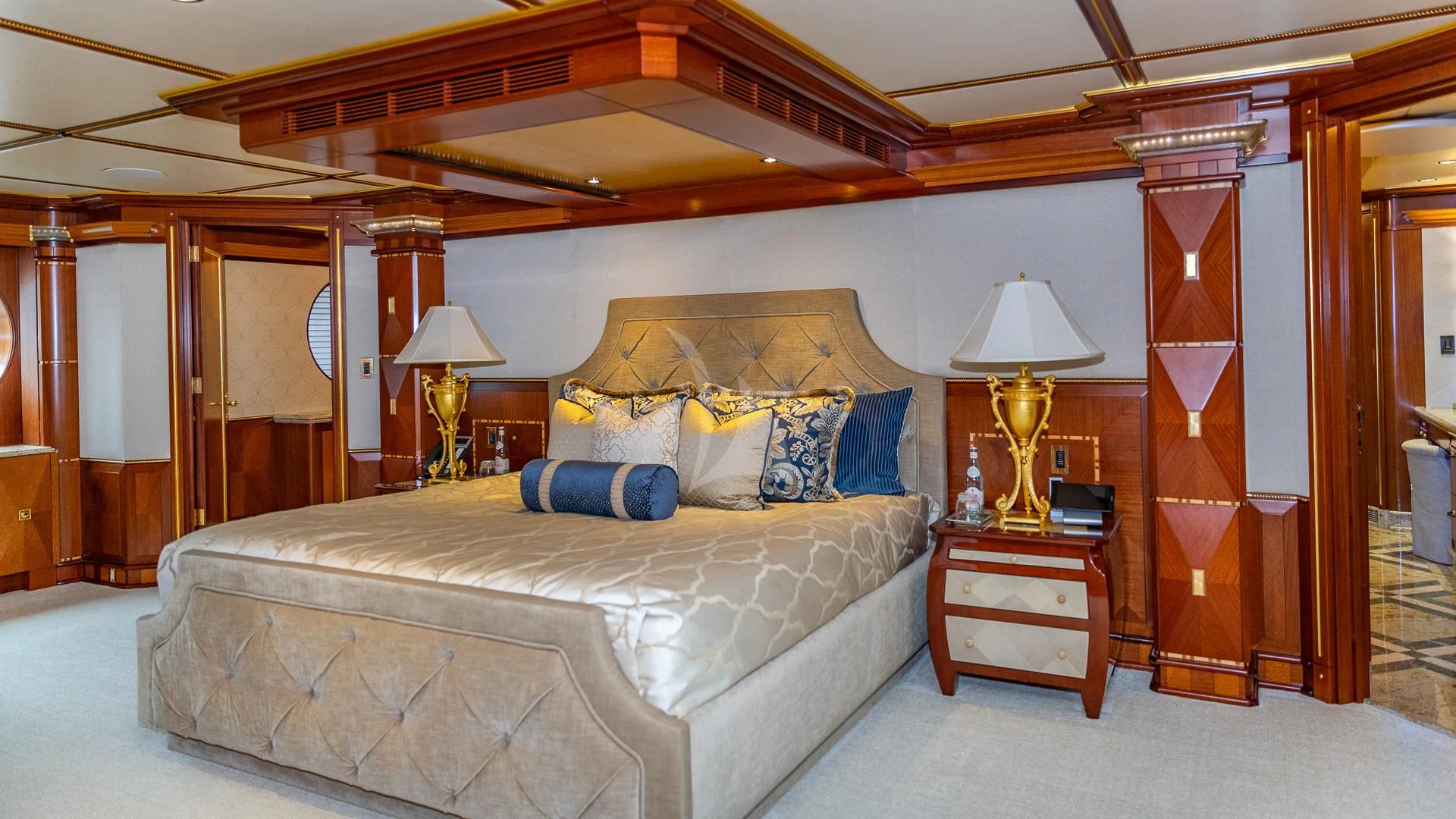 a large bed in a room aboard STARSHIP Yacht for Charter