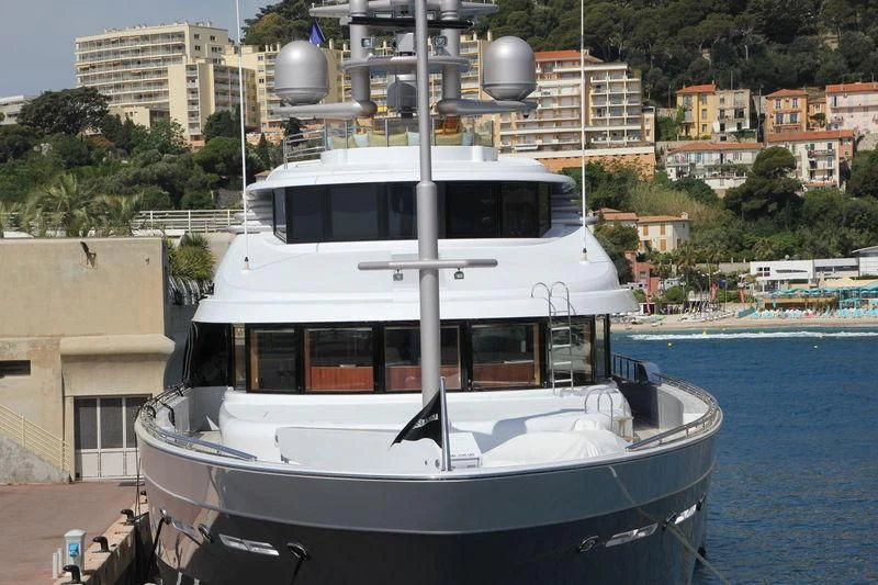 a boat docked at a pier aboard STARSHIP Yacht for Charter