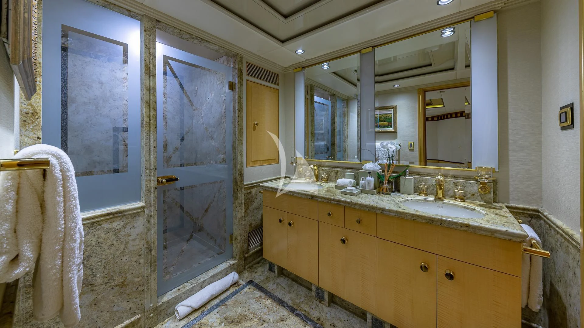 a bathroom with a large glass shower aboard STARSHIP Yacht for Charter