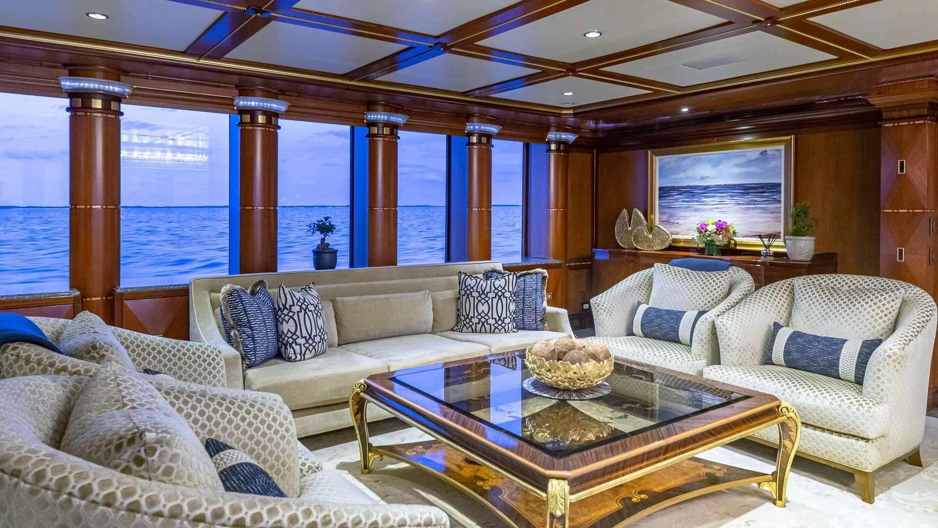 a living room with a large window aboard STARSHIP Yacht for Charter