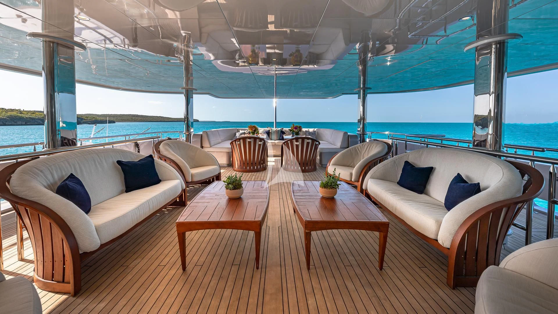 a room with a couch and a table and chairs aboard STARSHIP Yacht for Charter
