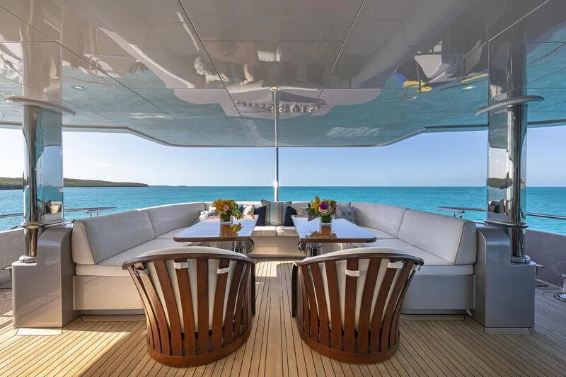 a room with a table and chairs aboard STARSHIP Yacht for Charter