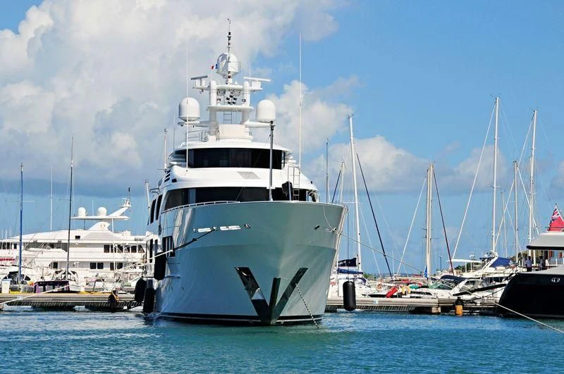 a group of boats in a harbor aboard STARSHIP Yacht for Charter
